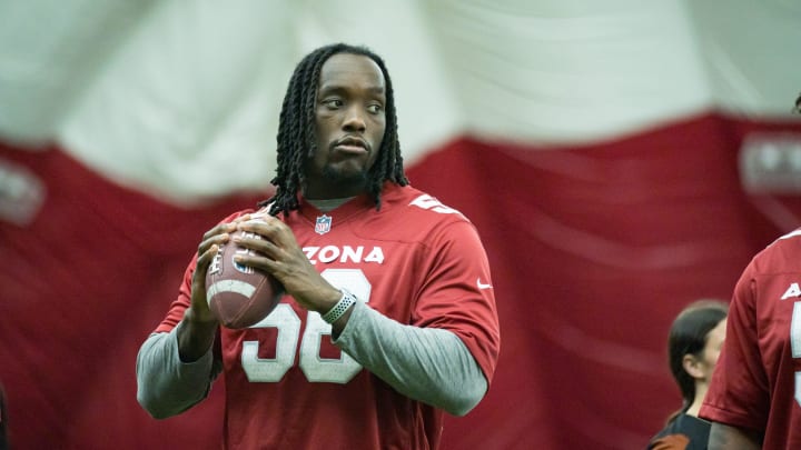 Darius Robinson runs drills with local high schoolers at the Cardinals girls flag football clinic on June 1, 2024 in Tempe, Ariz.