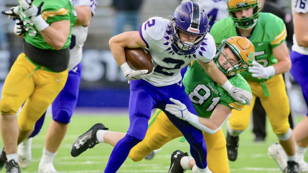 Anacortes wide receiver Brady Beaner pulls away from a defender in WIAA Class 2A championship game.