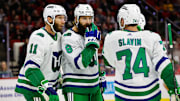 Carolina Hurricanes players wearing the franchise's Hartford Whalers throwback uniforms.