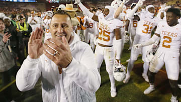 Texas Longhorns football head coach Steve Sarkisian celebrates with the team after winning 26-16 over Iowa State in the Big-12 football at Jack Trice Stadium on Saturday, Nov. 18, 2023, in Ames, Iowa