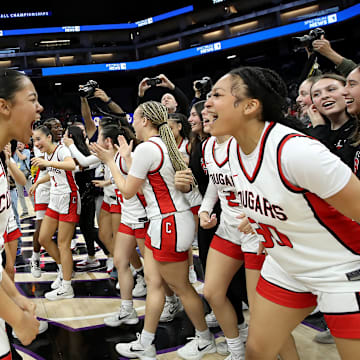 Carondelet celebrates after its 51-48 win over Sage Hill for the CIF State Division 3 girls championship at Golden 1 Center in Sacramento.