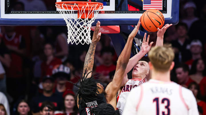 Feb 14, 2026; Tucson, Arizona, USA; Texas Tech Red Raiders forward JT Toppin (15) blocks a layup attempt by Arizona Wildcats forward Ivan Kharchenkov (8) during the first half of the game at McKale Memorial Center. Mandatory Credit: Aryanna Frank-Imagn Images