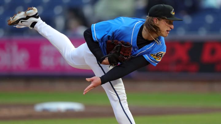 Akron RubberDucks pitcher Doug Nikhazy (29) follows through on a pitch during the first inning of an opening-day baseball game against the Altoona Curve at Canal Park, Friday, April 5, 2024, in Akron, Ohio.