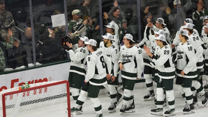 Tanner Kelly and his MSU Spartan hockey team celebrate the Spartan's Big Ten Championship after
