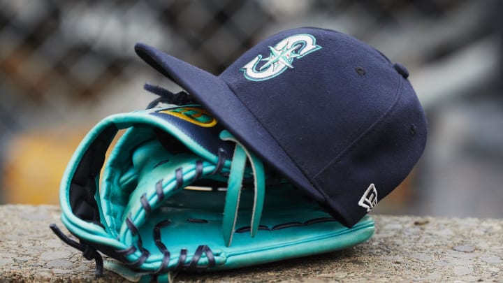 Hat and glove of Seattle Mariners center fielder Dee Gordon (9) sits in dugout during the third inning against the Detroit Tigers at Comerica Park.