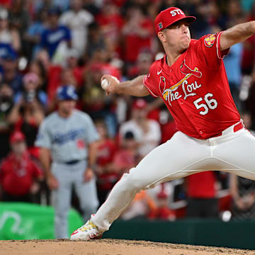 Aug 17, 2024; St. Louis, Missouri, USA; St. Louis Cardinals pitcher Ryan Helsley (56) throws the final strike for the final out of the game against the Los Angeles Dodgers at Busch Stadium in the ninth inning. Mandatory Credit: Tim Vizer-Imagn Images