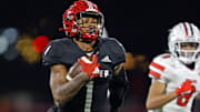 Jabree Wallace-Coleman of Imhotep Charter runs the ball during the 2023 PIAA Class 5A state championship game against Peters Township.