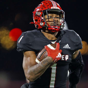 Jabree Wallace-Coleman of Imhotep Charter runs the ball during the 2023 PIAA Class 5A state championship game against Peters Township.