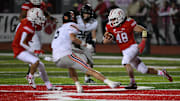 Joshua Bladel #48 of the Moon Tigers carries the ball in the first half during the game against the Bethel Park Black Hawks at Tiger Stadium on Friday Night in Moon Township, Pennsylvania.