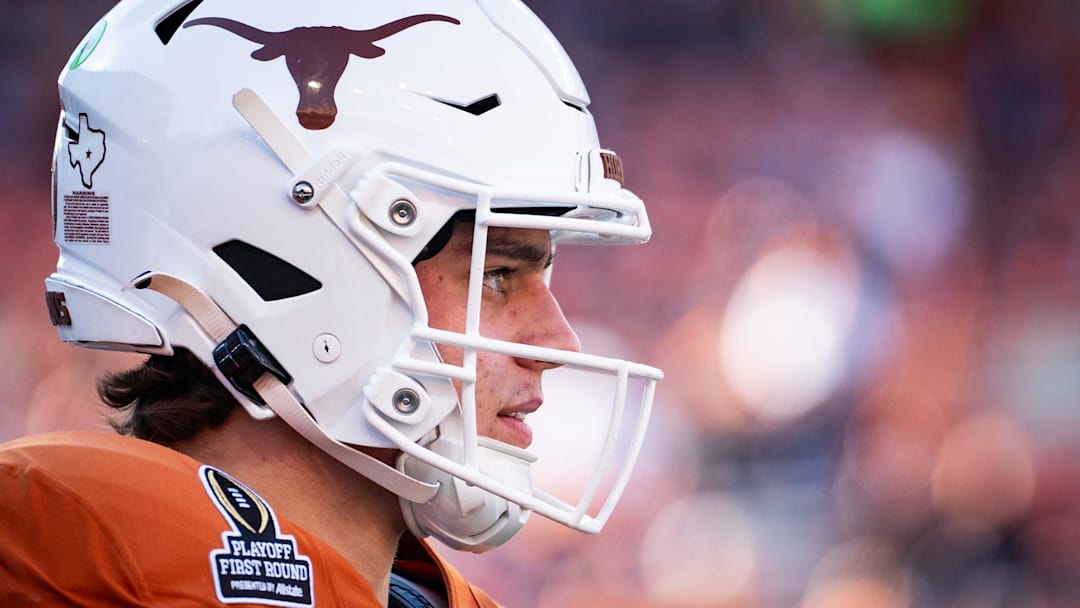 Texas Longhorns quarterback Arch Manning (16) warms up as the Texas Longhorns prepare to play the Clemson Tigers in the first round of the College Football Playoffs.