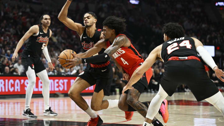 Apr 12, 2024; Portland, Oregon, USA; Houston Rockets guard Jalen Green (4) drives to the basket during the first half against Portland Trail Blazers guard Rayan Rupert (72) at Moda Center. Mandatory Credit: Troy Wayrynen-USA TODAY Sports