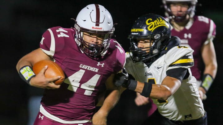 Mishawaka's Chase Gooden (44) gets past Fort Wayne Snider's Brandon Logan (4) during Friday night   s Regional game at Mishawaka.

Fort Wayne Snider Mishawaka Football