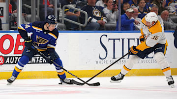 Dalibor Dvorsky in a one-on-one puck battle against Cole Smith