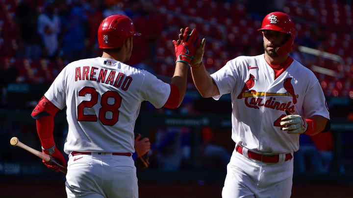 May 5, 2021; St. Louis, Missouri, USA;  St. Louis Cardinals first baseman Paul Goldschmidt (46) is congratulated by third baseman Nolan Arenado (28) after hitting a solo home run during the first inning against the New York Mets in game one of a doubleheader at Busch Stadium. Mandatory Credit: Jeff Curry-USA TODAY Sports