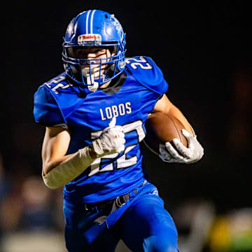 Hayden Lobos running back runs with the ball against the Mogollon Mustangs during the 1A state championship game at Coronado High School's football field in Scottsdale on Nov. 11, 2023.
