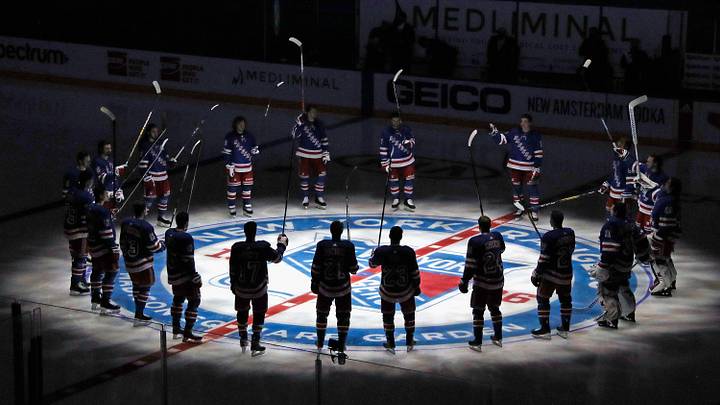 Jan 14, 2021; New York, NY, USA; New York Rangers players huddle around the center ice logo as they prepare for the home opener against the New York Islanders at Madison Square Garden. Jan 14, 2021; New York, NY, USA; New York Rangers players huddle around the center ice logo as they prepare for the home opener against the New York Islanders at Madison Square Garden.