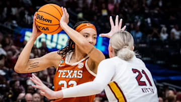 Texas Longhorns guard Ndjakalenga Mwenentanda (32) protects the ball from South Carolina Gamecocks forward Chloe Kitts (21) in the second half of the Longhorns' NCAA Playoff semi-final game against the South Carolina Gamecocks at Amalie Arena in Tampa, Florida, April 4, 2025.