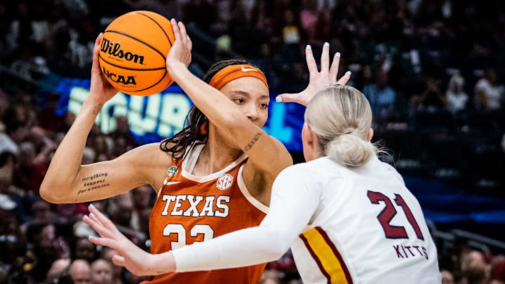 Texas Longhorns guard Ndjakalenga Mwenentanda (32) protects the ball from South Carolina Gamecocks forward Chloe Kitts (21) in the second half of the Longhorns' NCAA Playoff semi-final game against the South Carolina Gamecocks at Amalie Arena in Tampa, Florida, April 4, 2025.