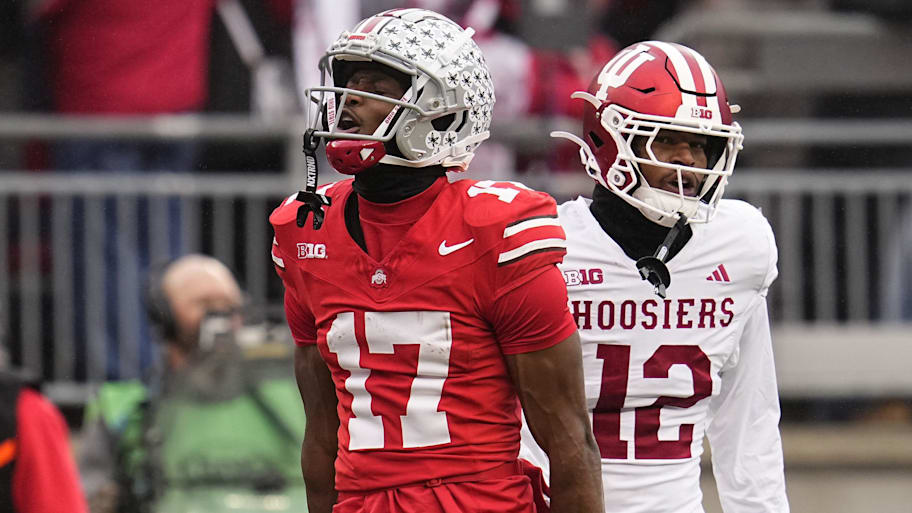 Ohio State Buckeyes wide receiver Carnell Tate (17) celebrates a first down catch beside Indiana Hoosiers defensive back Terry Jones Jr. (12) during the NCAA football game at Ohio Stadium in Columbus on Monday, Nov. 25, 2024. Ohio State won 38-15. | Adam Cairns/Columbus Dispatch / USA TODAY NETWORK via Imagn Images