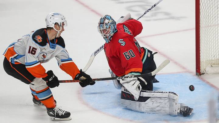 Sasha Pastujov, 16, of San Diego scores the winning goal in a shootout against Coachella Valley Firebird goalie Chris Driedger at Acrisure Arena in Palm Desert, Calif, April 21, 2024.