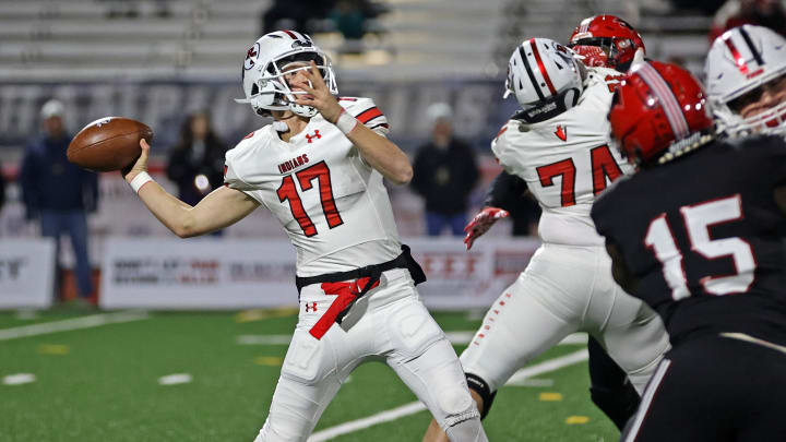 Peters Township quarterback Nolan DiLucia attempts a pass against Imhotep Charter in the 2023 PIAA Class 5A state championship game 