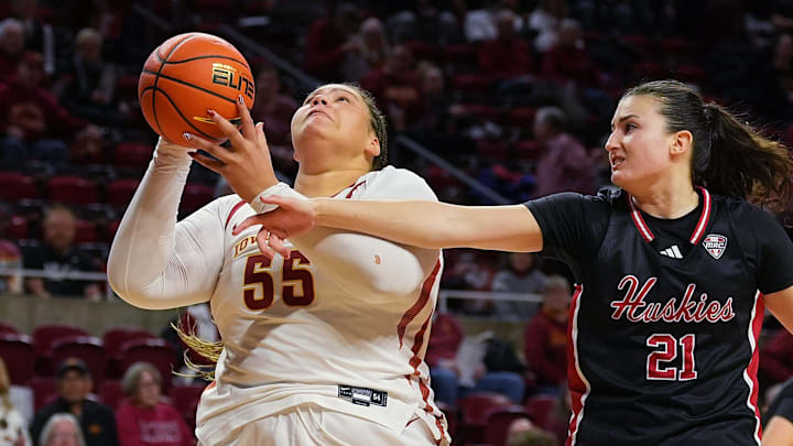 Iowa State Cyclones' center Audi Crooks (55) shoots the ball around Northern Illinois Huskies forward Marta Hermoso (21) during the first quarter in the NCAA women basketball non-conference game on Dec. 7, 2025, at Hilton Coliseum in Ames, Iowa.