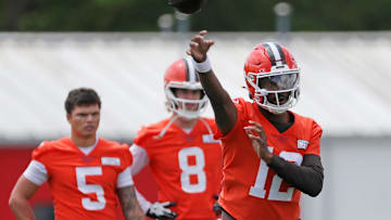 Browns quarterback Shedeur Sanders throws as QBs Dillon Gabriel (5) and Kenny Pickett look on during minicamp, Tuesday, June 10, 2025, in Berea.