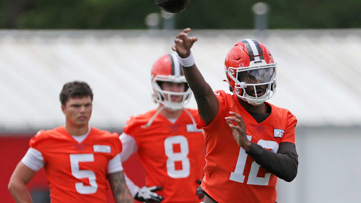 Browns quarterback Shedeur Sanders throws as QBs Dillon Gabriel (5) and Kenny Pickett look on during minicamp, Tuesday, June 10, 2025, in Berea.