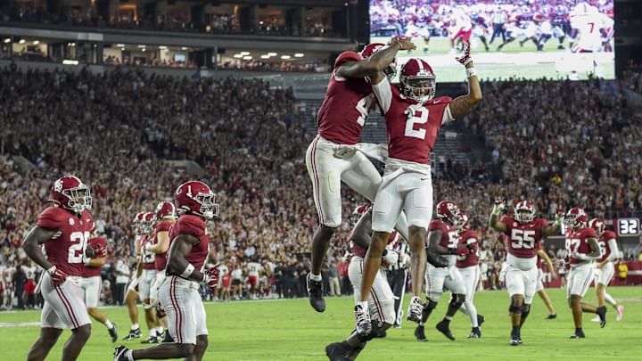 Aug 31, 2024; Tuscaloosa, Alabama, USA;  Alabama Crimson Tide quarterback Jalen Milroe (4) and wide receiver Ryan Williams (2) celebrate a touchdown by Williams against the Western Kentucky Hilltoppers at Bryant-Denny Stadium. Mandatory Credit: Gary Cosby Jr.-Imagn Images