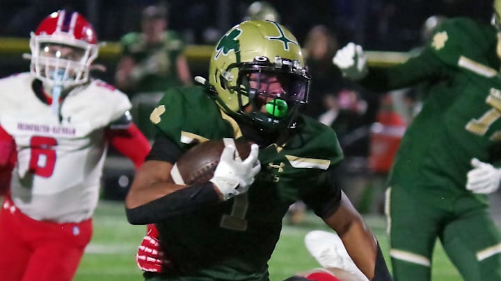Xavier Baker (1) of the Bishop Feehan runs the ball against Bridgewater-Raynham in the MIAA Division II semifinals over the weekend. Xavier Baker (1) of the Bishop Feehan runs the ball against Bridgewater-Raynham in the MIAA Division II semifinals over the weekend.