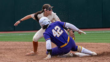 Texas utility Leighann Goode (43) attempts to tag out LSU utility Tori Edwards (42) during the game against LSU at Red & Charline McCombs Field on Thursday, April 17, 2025 in Austin.