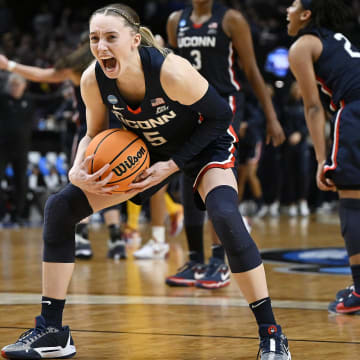 Apr 1, 2024; Portland, OR, USA; UConn Huskies guard Paige Bueckers (5) celebrates after beating the USC Trojans in the finals of the Portland Regional of the NCAA Tournament at the Moda Center. Mandatory Credit: Troy Wayrynen-USA TODAY Sports