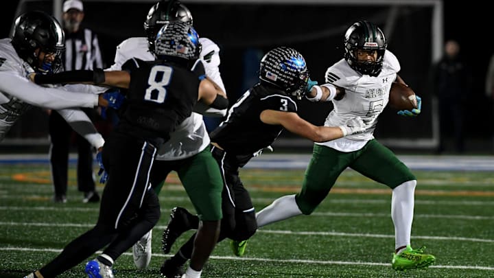 Decatur's Gavin Solito (3) tackles Milford Mill's Damon Ferguson (5) Friday, Nov. 24, 2023, in the 2A State Semifinal in Berlin, Maryland. Decatur defeated Milford Mill 35-34. Decatur's Gavin Solito (3) tackles Milford Mill's Damon Ferguson (5) Friday, Nov. 24, 2023, in the 2A State Semifinal in Berlin, Maryland. Decatur defeated Milford Mill 35-34.