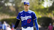Los Angeles Dodgers' Shohei Ohtani walks to the dugout