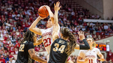 Indiana's Julianna LaMendola (20) shoots between Purdue's Kendall Puryear (22) and Reagan Bass (34) during the Indiana versus Purdue women's basketball game at Simon Skjodt Assembly Hall on Saturday, Feb. 15, 2025.