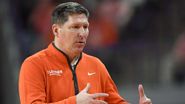 Feb 26, 2025; Clemson, South Carolina, USA; Clemson Head Coach Brad Brownell reacts with the team in the game against Notre Dame during the second half at Littlejohn Coliseum. Mandatory Credit: Ken Ruinard-Imagn Images