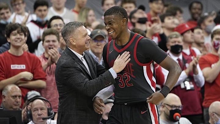 Ohio State Buckeyes forward E.J. Liddell (32) gets a pat on the shoulder from head coach Chris Holtmann during the second half of the NCAA men's basketball game at Value City Arena in Columbus on Saturday, Dec. 11, 2021. The Buckeyes won 73-55.