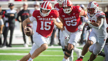 Indiana's Fernando Mendoza (15) runs during the Indiana versus Wisconsin football game at Memorial Stadium on Saturday, Nov. 15, 2025.