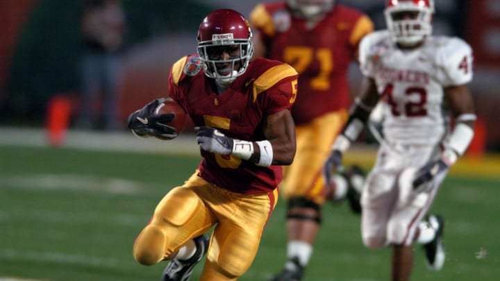 Jan 4, 2005; Miami Gardens, FL, USA; Southern California Trojans tailback Reggie Bush heads up field on the first play form scrimmage in a 55-19 victory over Oklahoma in the FedEx Orange Bowl during the BCS National Championship at Pro Player Stadium. Mandatory Credit: Kirby Lee-USA TODAY Sports