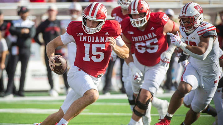 Indiana's Fernando Mendoza (15) runs during the Indiana versus Wisconsin football game at Memorial Stadium on Saturday, Nov. 15, 2025.