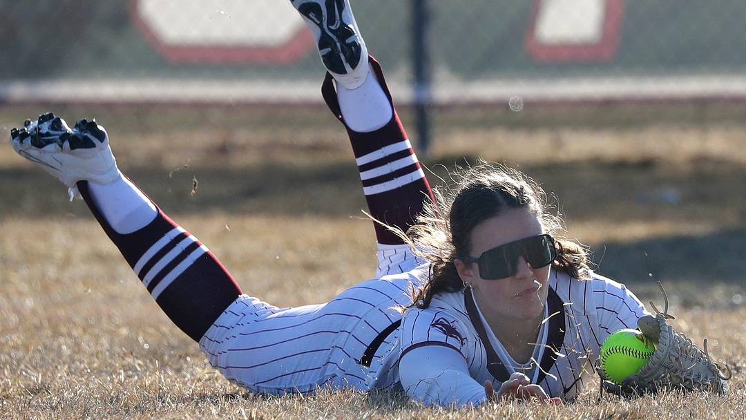 Fox Valley Lutheran outfielder Natalie Bromm (7) makes a diving catch versus Menasha during a Bay Conference game on March 31, 2026. Fox Valley Lutheran outfielder Natalie Bromm (7) makes a diving catch versus Menasha during a Bay Conference game on March 31, 2026.