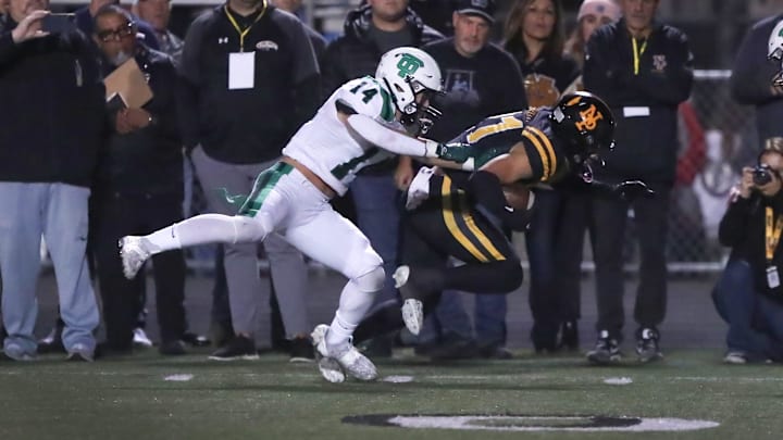 Newbury Park's Shane Rosenthal is taken out of bounds by Thousand Oaks' Preston Handler during the first quarter of the teams' CIF-SS Division 5 semifinal game on Friday, Nov. 17, 2023, at Newbury Park High. Newbury Park won 22-19. Newbury Park's Shane Rosenthal is taken out of bounds by Thousand Oaks' Preston Handler during the first quarter of the teams' CIF-SS Division 5 semifinal game on Friday, Nov. 17, 2023, at Newbury Park High. Newbury Park won 22-19.