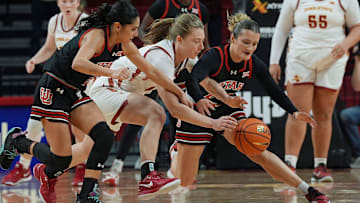 Iowa State Cyclones' guard Emily Ryan (11) and Utah Utes guard Inês Vieira (2) and Utah Utes guard Matyson Wilke (23) battle for a loose ball during the fourth quarter in the NCAA women’s basketball at Hilton Coliseum on Sunday, Jan. 5, 2025, in Ames, Iowa.