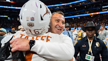 Texas Longhorns head coach Steve Sarkisian embraces Texas Longhorns defensive back Michael Taaffe (16) as they celebrate their win in the Peach Bowl College Football Playoff quarterfinal against Arizona State at Mercedes-Benz Stadium in Atlanta, Georgia, Jan. 1, 2025.