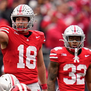 Ohio State quarterback Will Howard motions at the line of scrimmage during a game. The Buckeyes host archrival Michigan this weekend.