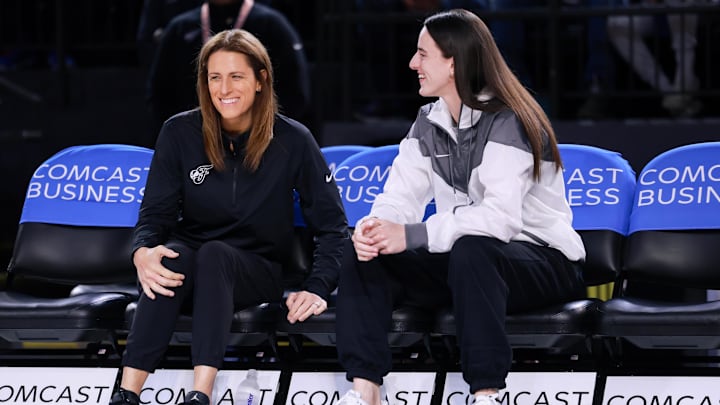 May 28, 2025; Washington, District of Columbia, USA; Indiana Fever guard Caitlin Clark talks with head coach Stephanie White before the game against the Washington Mystics at Entertainment & Sports Arena. Mandatory Credit: Emily Faith Morgan-Imagn Images
