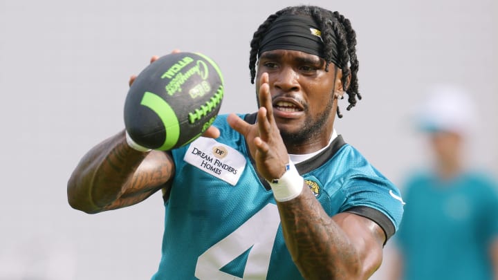 Jacksonville Jaguars running back Tank Bigsby (4) warms up during the second day of an NFL football training camp practice session Thursday, July 25, 2024 at EverBank Stadium's Miller Electric Center in Jacksonville, Fla.