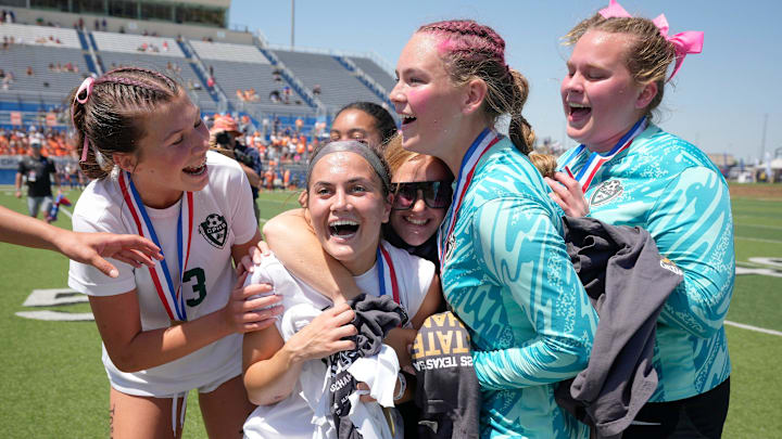 Meredith Koltz of Cedar Park, second from left, is congratulated by teammates after she was named MVP of the win against Frisco Wakeland at the UIL Soccer State Championships in at Birkelbach Field in Georgetown Friday April 11, 2025.