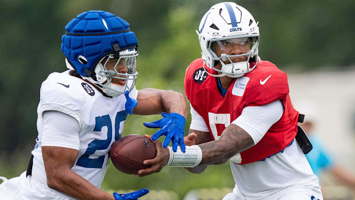 Indianapolis Colts quarterback Anthony Richardson Sr. (5) hands off to running back Jonathan Taylor (28) on Monday, July 28, 2025, during training camp held at Grand Park in Westfield. Indianapolis Colts quarterback Anthony Richardson Sr. (5) hands off to running back Jonathan Taylor (28) on Monday, July 28, 2025, during training camp held at Grand Park in Westfield.