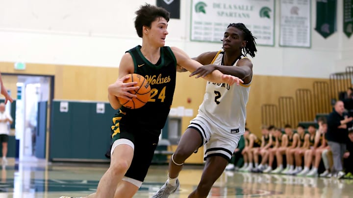 Luke Isaak of San Ramon Valley drives against Ajahni Charles of Bishop O'Dowd during the 27th MLK Classic at De La Salle High School. San Ramon Valley advanced in the NCS's Open Division; O'Dowd a first-round game to Amador Valley. Luke Isaak of San Ramon Valley drives against Ajahni Charles of Bishop O'Dowd during the 27th MLK Classic at De La Salle High School. San Ramon Valley advanced in the NCS's Open Division; O'Dowd a first-round game to Amador Valley.